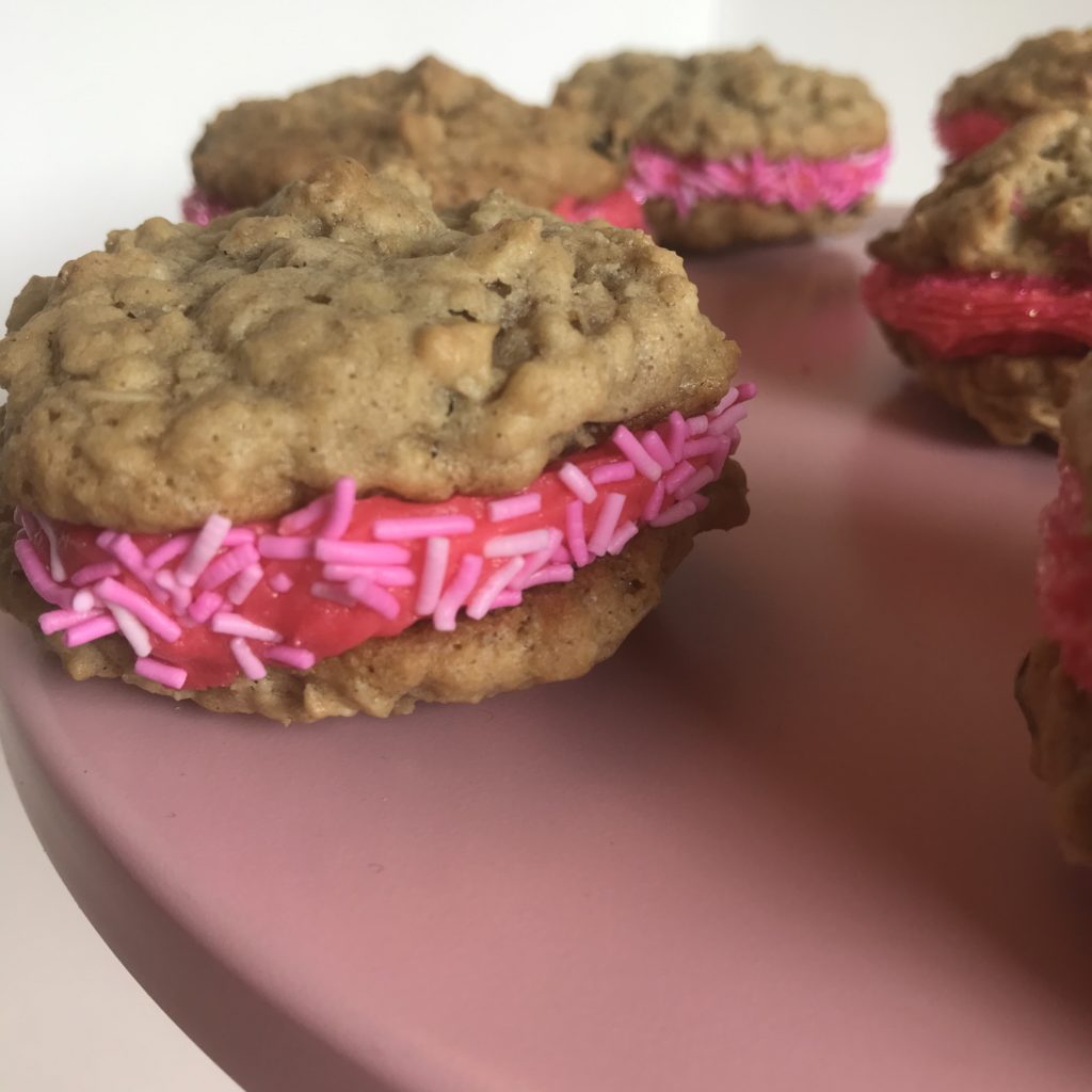 Oatmeal raisin cookie with pink frosting