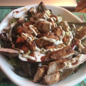 Garden salad with BBQ chicken and Ranch dressing
